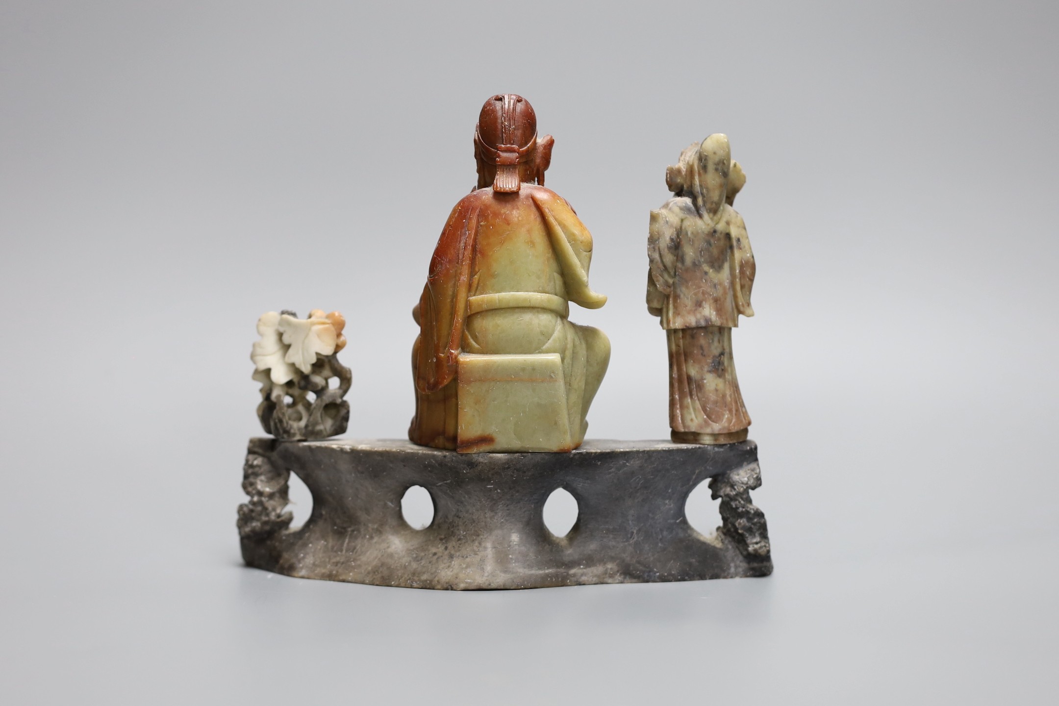 A Chinese soapstone deity figure group, 20cm wide